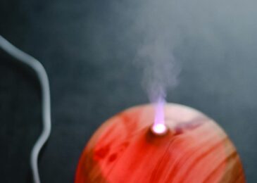 Wood-grain essential oil diffuser producing aromatic mist with LED light - nebulizer vs ultrasonic comparison
